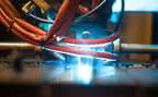 Laser cutting process in CNC manufacturing equipment.