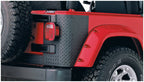 Bushwacker 97-06 Jeep Wrangler Trail Armor Rear Corners - Black on red Jeep with offroad tires.