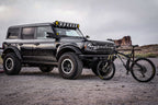 KC HiLiTES 2021+ Ford Bronco 50in Overhead Light Bar Mounting Bracket Set on black Bronco with bike.