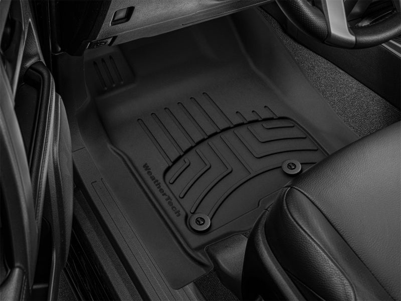 WeatherTech 2013+ Toyota 4Runner Front FloorLiner HP - Black in vehicle footwell