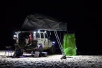 KC HiLiTES C-Series C2 LED 2in. Backup Area Flood Light 20w (Pair Pack System) - Black on off-road vehicle at night.