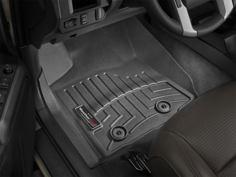 WeatherTech 2018+ Toyota Tacoma Front FloorLiner - Black (Fits Access/Double Cab) interior view with textured grip.