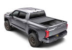 Retrax 2007-2020 Toyota Tundra CrewMax 5.5ft Bed RetraxPRO XR with Deck Rail System on offroad truck.