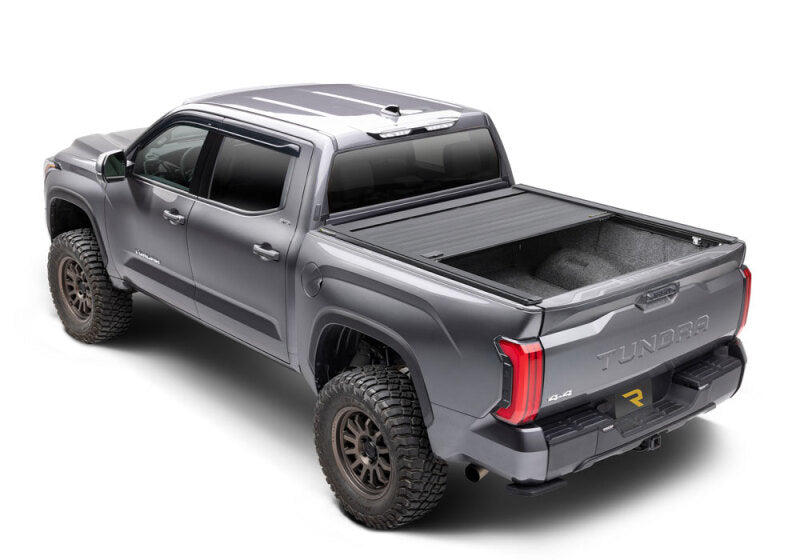 Retrax 2007-2020 Toyota Tundra CrewMax 5.5ft Bed RetraxPRO XR with Deck Rail System on offroad truck.