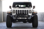 DV8 Offroad 18-23 Jeep Wrangler JL / 20-23 Jeep Gladiator JT FS-7 Mid-Width Winch Front Bumper on white Jeep