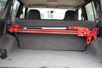Fishbone Offroad 84-01 Jeep Cherokee XJ Rear Seat Hi-Lift Jack Mount installed in vehicle for offroad use.
