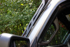 Fishbone Offroad 2018+ Jeep Wrangler JL Windshield Light Bracket mounted on a Jeep for offroad lighting.