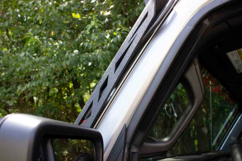 Fishbone Offroad 2018+ Jeep Wrangler JL Windshield Light Bracket mounted on a Jeep for offroad lighting.