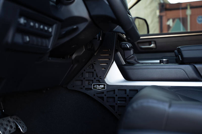 DV8 Offroad 22-23 Toyota Tundra Center Console Molle Panels/Device Mount installed in truck interior