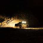 KC HiLiTES Platform One Profile 10in. SideCast Flush Mount Lights in action on offroad truck at night.
