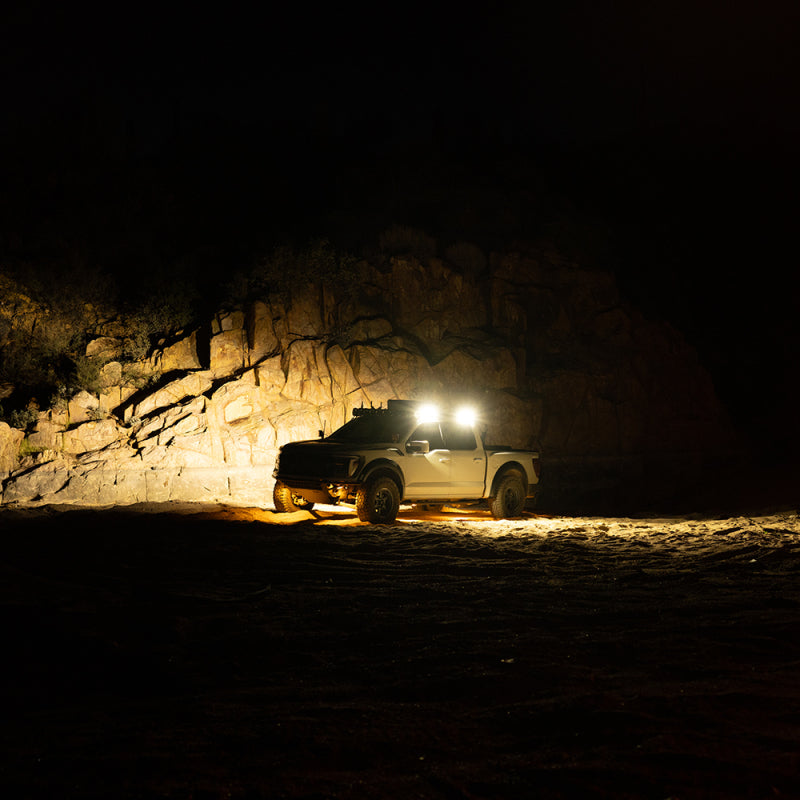 KC HiLiTES Platform One Profile 10in. SideCast Flush Mount Lights in action on offroad truck at night.