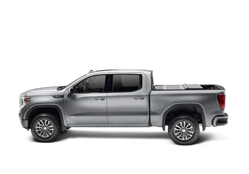 BAK 2020 Chevy Silverado 2500/3500 HD 6ft 9in Bed BAKFlip F1 on a rugged truck, showcasing durability and style.