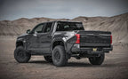 Magnaflow 2024 Toyota Tacoma Speq Series Cat-back Exhaust System on lifted truck with offroad wheels and tires