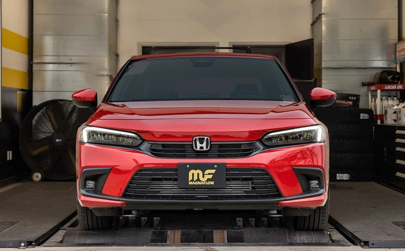 Magnaflow 2022+ Honda Civic Sport 2.0 Sedan NEO Cat-Back Exhaust System in red car garage