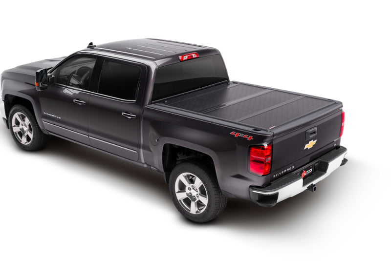 BAK 14-18 Chevy Silverado 1500 / 15-20 2500/3500 8ft Bed BAKFlip G2 truck bed cover on a black Silverado