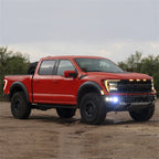 Rigid Industries 2021+ Ford Raptor Triple Fog Lights Kit on red truck