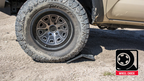 Body Armor 4x4 Backbone Hitch Skid on offroad tire.