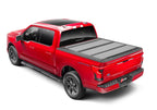 BAK 21-22 Ford F-150 (Incl. 2022 Lightning) BAKFlip MX4 5.7ft Bed Cover - Matte Finish on a red truck