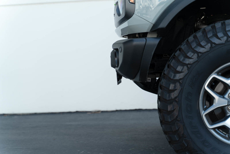 DV8 Offroad 21-23 Ford Bronco Capable Bumper Front License Plate Mount installed with offroad tires