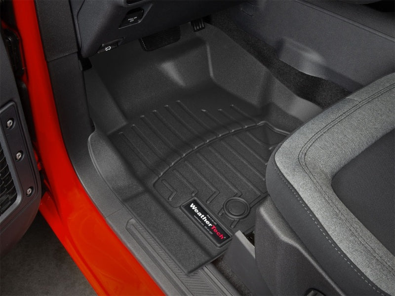 WeatherTech 2021+ Ford Bronco 4 Door Front FloorLiner - Black installed in vehicle, showcasing interior protection and fit