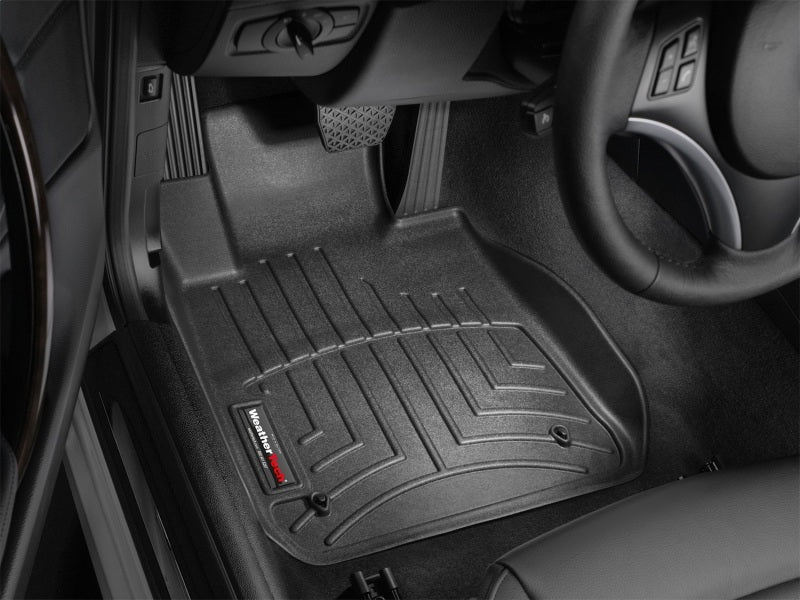 WeatherTech 08+ BMW 1-Series (E82/E88) Front FloorLiner - Black installed in vehicle interior.