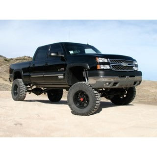 Black lifted truck with offroad wheels and bumpers.