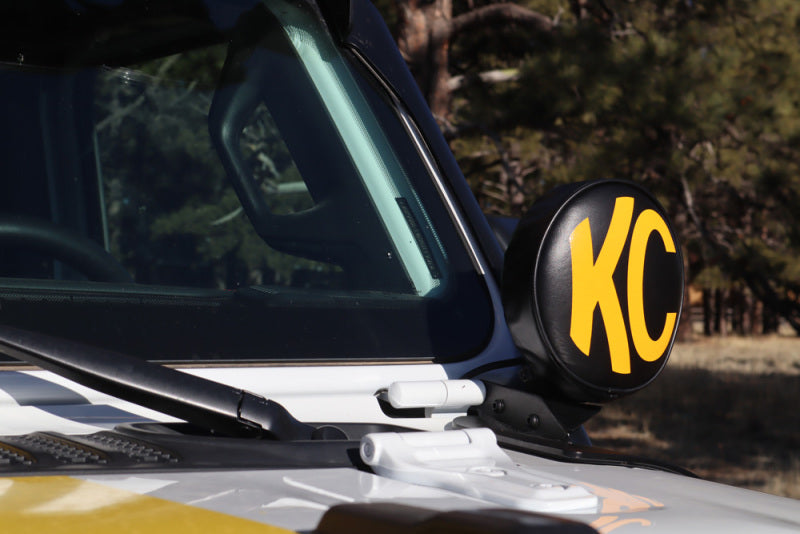 KC HiLiTES 6in. Round Soft Cover (Pair) - Black w/Yellow KC Logo on Jeep