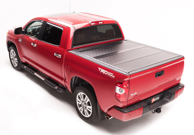 BAK 2022+ Toyota Tundra 5.5ft Bed BAKFlip G2 Bed Cover on red truck Main image