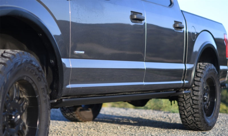 AMP Research 15-20 Chevy/GMC Silverado 2500-3500/Sierra 2500-3500/Crew & Double Cab PowerStep on off-road truck.