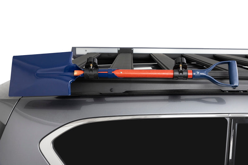 ARB BASE Rack Shovel Holder mounted on a vehicle roof, perfect for offroad parts.