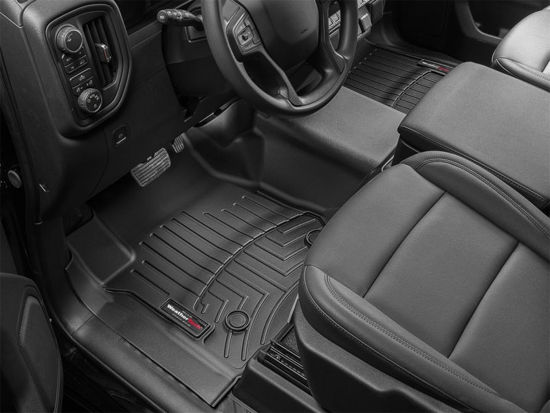 WeatherTech 2019+ Chevrolet Silverado 1500 / GMC Sierra (Regular Cab) Front Vinyl FloorLiner - Black installed in truck cabin.