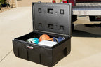 Deezee Universal Tool Box - Specialty Utility Chest Plastic 37In in use for storage outside a vehicle.
