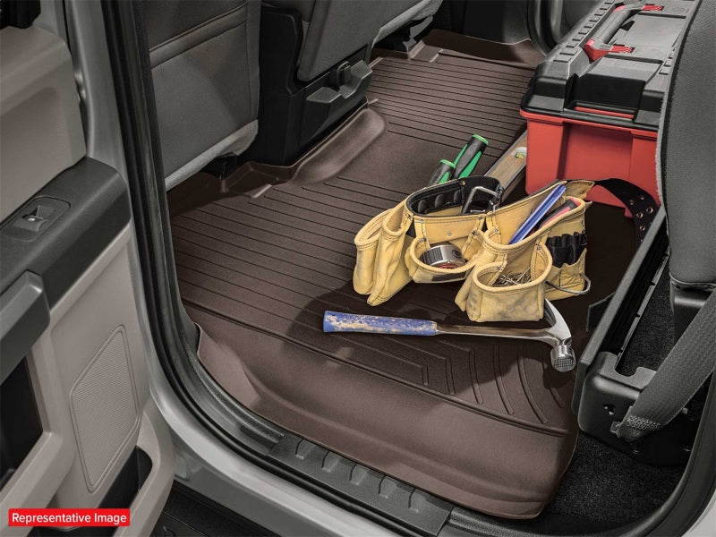 WeatherTech 2017+ Ford F-250/F-350/F-45-/F-550 Vinyl Front FloorLiner - Black in truck interior with tools.