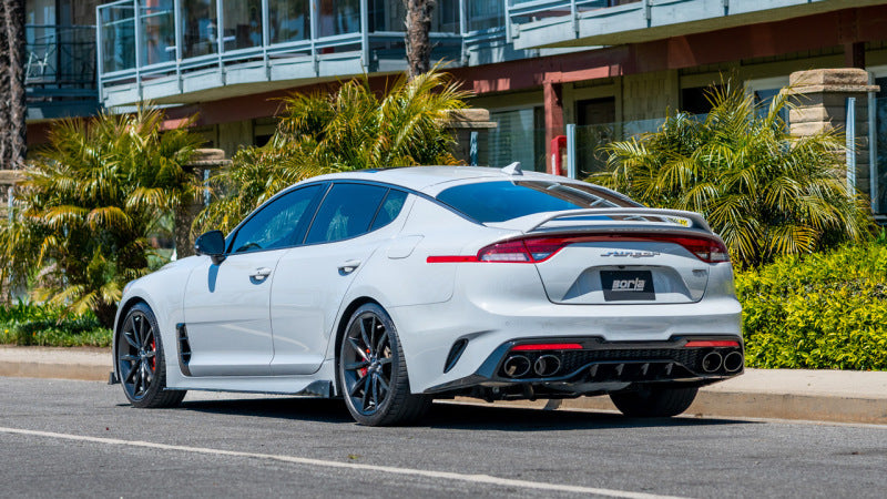 Borla 22-23 Kia Stinger 3.3L V6 Turbo 2.25in Pipe Dia Dual Split Rear Exit S-Type Cat-Back Exhaust on a white car.