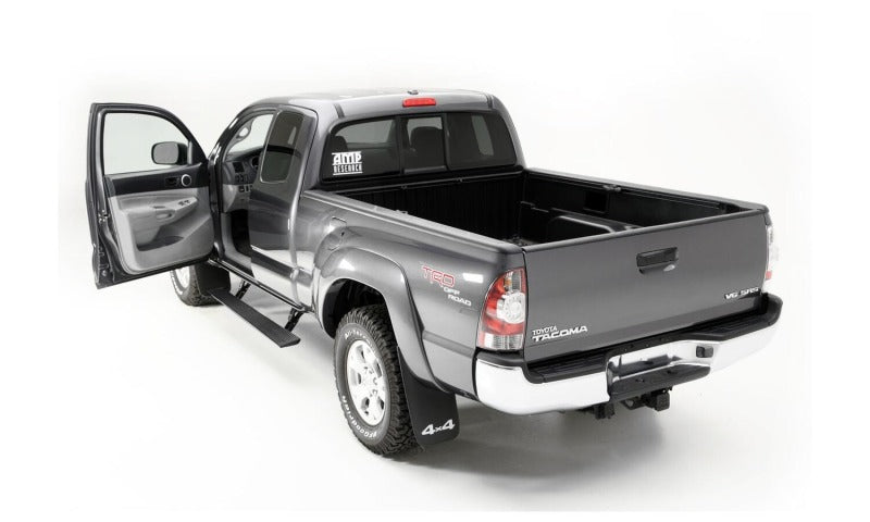 AMP Research 2016-2017 Toyota Tacoma Double Cab/Access PowerStep - Black with open door, showcasing offroad accessories.