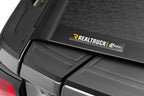 Close-up of BAK 2020 Chevy Silverado 2500/3500 HD 6ft 9in Bed BAKFlip F1 truck bed cover details.