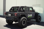 DV8 Offroad 18-23 Jeep Wrangler JL 4-Door Speaker/Light Bar Mount with upgraded offroad tires and accessories.