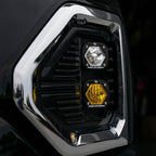 Baja Designs 19+ GMC 1500 S1 Fog Pocket Mount Kit Clear Spot / Amber Wide Cornering lighting features on black truck