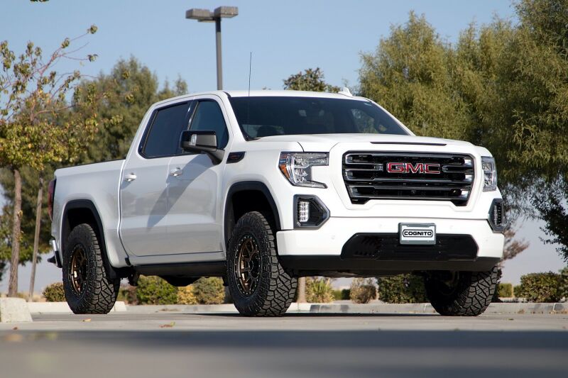 Cognito 19-24 Chevy Silv/Sierra 1500 2/4WD 3in Perf Ball Joint Lvl Lift Kit w/Fox PS Coilovr 2.0 IFP on white GMC truck