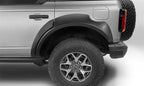 Bushwacker 2021+ Ford Bronco 4-Door Extend-A-Flares 4pc - Black on a truck with offroad tires and wheels.