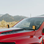 KC HiLiTES 2019+ RAM 1500 Rebel/TRX A-Pillar/Ditch Light Mount on red truck