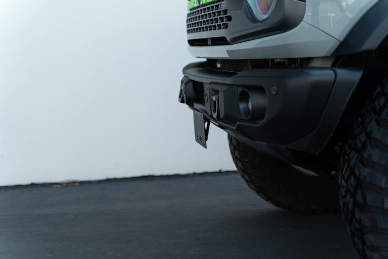 DV8 Offroad 21-23 Ford Bronco Capable Bumper Front License Plate Mount on a truck