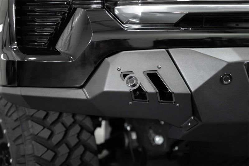 Addictive Desert Designs2022+ Chevrolet Silverado 1500 Black Label Front Bumper close-up with offroad lighting features.