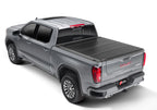 BAK 2020 Chevy Silverado 2500/3500 HD 6ft 9in Bed BAKFlip F1 truck bed cover installation on a gray GMC truck.