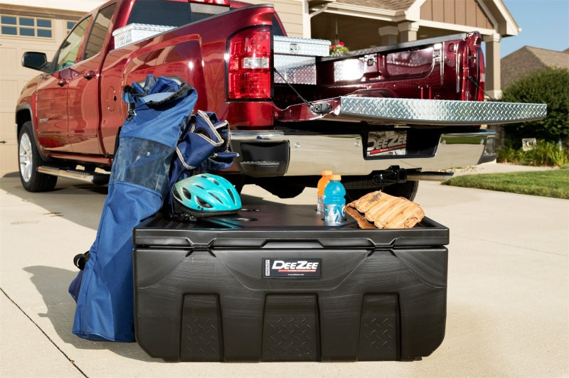 Deezee Universal Tool Box - Specialty Utility Chest Plastic 37In on truck with sports gear and drinks.