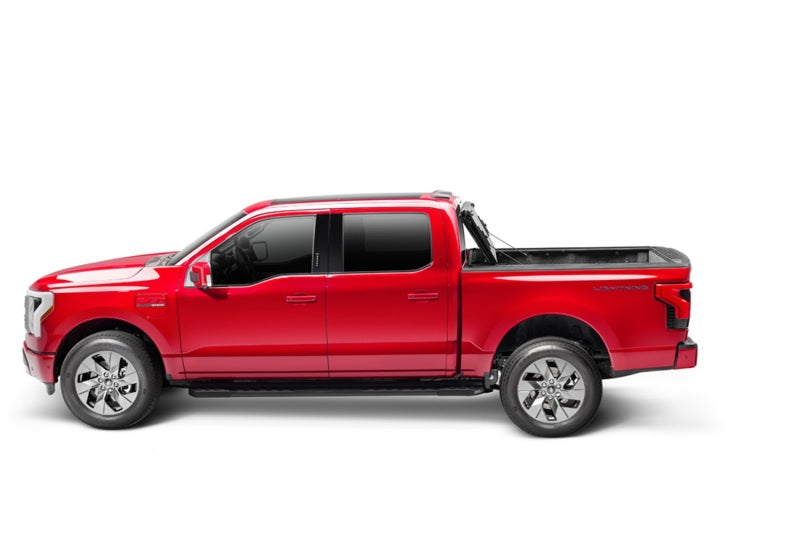 BAK 21-22 Ford F-150 (Incl. 2022 Lightning) BAKFlip MX4 5.7ft Bed Cover - Matte Finish on red Ford truck side view.