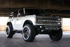 DV8 Offroad 21-22 Ford Bronco Competition Series Front Bumper on a lifted Bronco with offroad tires