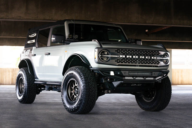 DV8 Offroad 21-22 Ford Bronco Competition Series Front Bumper on a lifted Bronco with offroad tires