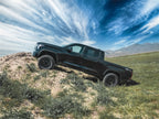 Tuff Country 2022 Toyota Tundra 2023 Sequoia 2in Leveling Kit on offroad terrain with offroad wheels.
