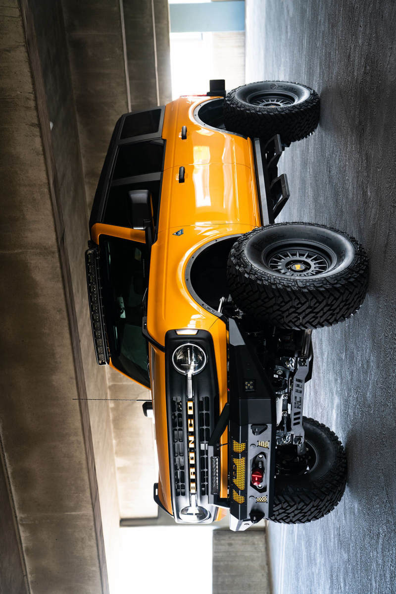 DV8 21+ Ford Bronco Curved Light Bracket for 12 3in. Pod Lights on yellow Ford Bronco with offroad tires and accessories.